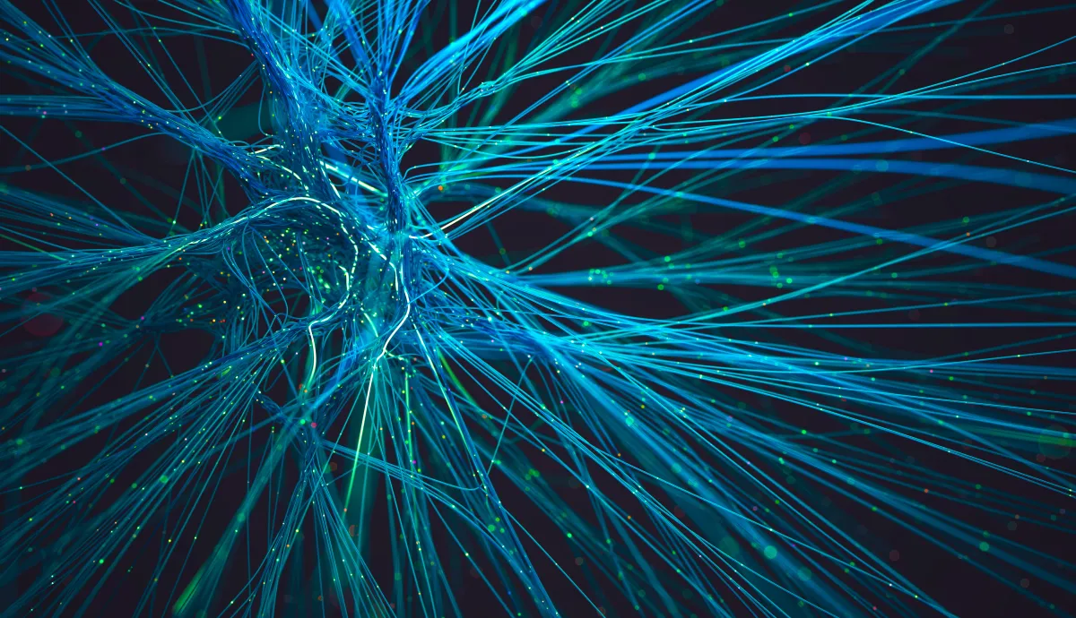 Intricate web of blue light trails suggesting a neural interface or fiber optic cables. Abstract visualization of artificial intelligence and data transmission.