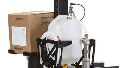 Compact ColorMatrix dispensing cart with digital controller, material container, and tubing mounted on a wheeled base.